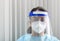 Nurse\'s close-up portrait with protective equipment