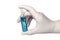 Nurse`s hand in medical latex glove with ampule