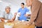 Nurse, senior and fighting over a game of dominoes with people in a retirement home for assisted living. Healthcare