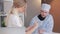 Nurse shows the doctor test tubes with tests in the laboratory. A doctor who examines a test tube with a red liquid