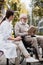 Nurse sitting near aged disabled man