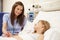 Nurse Sitting By Young Girl\'s Bed In Hospital