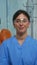 Nurse smiling at camera sitting in dental office