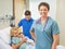 Nurse Standing With Couple And Newborn Baby In