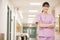 Nurse Standing In A Hospital Corridor
