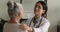Nurse tell hopeful words to older female patient