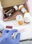 Nurse unpacking medication in boxes, pasting label return to the patient, conceptual image