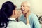 Nurse using medical stick while checking throat of patient