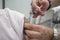 Nurse vaccinating little girl at Healthcare Center