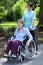 Nurse walking with disabled lady