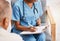 Nurse, writing notes and medical history with patient for healthcare, research or surgery planning. Closeup doctor