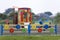 Nursery playground with bright toy car and colorful fence. Children activities and recreation outdoors