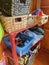 A nursery playschool equipment cupboard boxes on shelves with toys