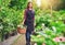 Nursery worker gathering flowers for sale