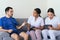 Nurses checking a man`s blood pressure at home