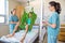 Nurses Looking At Patient Sitting On Cloth Of