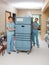 Nurses Pushing Trolley In Hospital Hallway