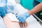 Nursing student prepare Sterile wound Kit for her patient. Closed-up to hand with soft focus.