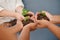 Nurture your business and watch it grow. an unrecognizable group of businesswomen holding plants growing out of soil