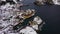 Nusfjord Fishing Village and Mountains in Winter. Lofoten Islands, Norway. Aerial View