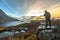 Nusfjord, Norway - November 17, 2018: Tourist take a photograph landscape at Nusfjord fishing village in Flakstad municipality in