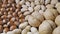 Nut: almonds, hazelnuts , walnuts on dark wooden background. Top view of different nuts rotation 360