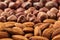 Nut background of different nuts - almond, hazelnut and kernel close-up.