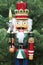 Nutcracker soldier and christmas tree as a background