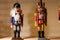 Nutcracker standing on a shelf. wooden figures, christmas, symbol;