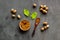 Nutmeg - ground indian condiment in spoon - on grey background top-down