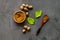 Nutmeg - ground indian condiment in spoon - on grey background top-down