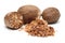 Nutmeg and nutmeg granules on white background