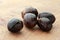 Nutmeg seeds in a wooden background