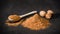 Nutmeg spice powder. Spoon and handful of chopped nutmeg. Nuts. Spices for recipes. Ground spice