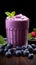 Nutrient packed breakfast blueberry smoothie with fresh, vibrant berries