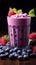 Nutrient packed breakfast blueberry smoothie with fresh, vibrant berries