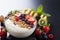 Nutrient packed oat granola bowl with fruits, yogurt, and nuts