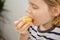 Nutrient-rich break: A child savors the sweetness of a ripe yellow plum, enjoying a nutritious fruity interlude