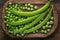 Nutrient rich display Fresh bio peas and pods on an oak board