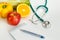 Nutrition and healthy eating. Fruits, vegetables and stethoscope