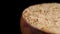 Nutritional brewers yeast flakes in rustic wooden bowl. Macro. Rotation.