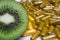 Nutritional vitamins supplement concept: Macro close up of isolated half sliced fresh ripe green kiwifruit with pile brown and