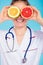 Nutritionist covering her eyes with fruits