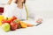 Nutritionist desk with fruit and measuring tape