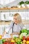 Nutritionist desk with healthy vegetables. Skilled professional dietitian working on diet plan