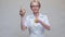 Nutritionist doctor healthy lifestyle concept - holding ginger root and measuring tape