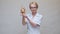 Nutritionist doctor healthy lifestyle concept - holding ginger root and measuring tape