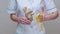 Nutritionist doctor healthy lifestyle concept - holding ginger root and measuring tape