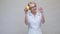 Nutritionist doctor healthy lifestyle concept - holding lemon fruit and medicine or vitamin pill