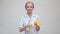 Nutritionist doctor healthy lifestyle concept - holding orange fruit